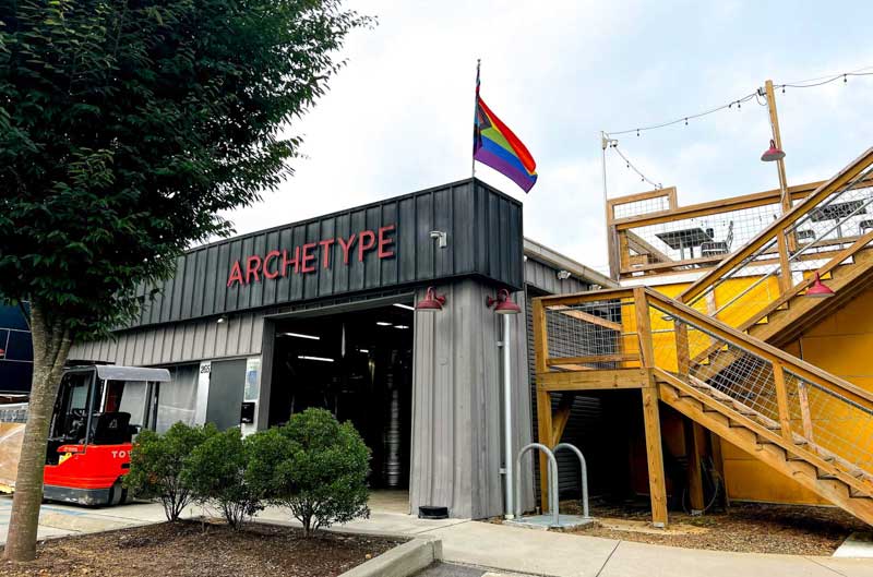 Exterior of Archetype Brewing Haywood in West Asheville showing outdoor seating