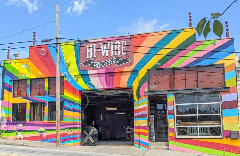 Hi-Wire Brewing's building in South Slope with a colorful mural out front