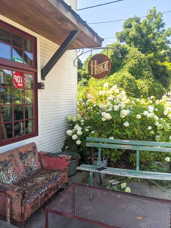 Hole Doughnuts exterior seating next to blooming hydrangeas