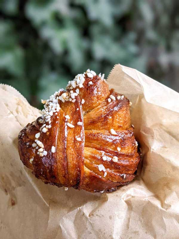 Cardamom bun from West Asheville in bakery paper