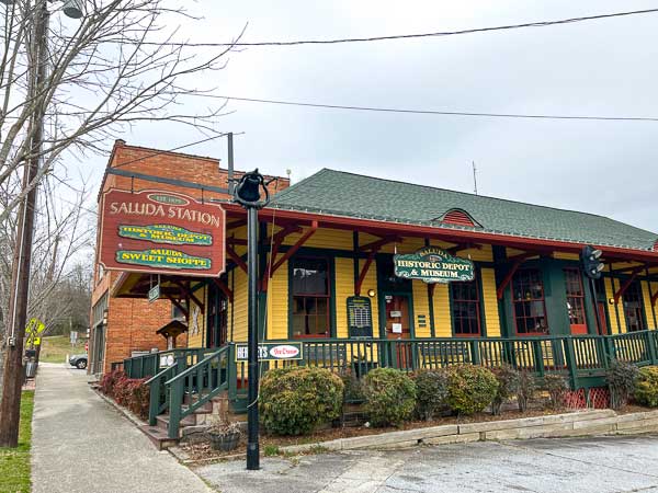 Saluda station showing signs for various shops