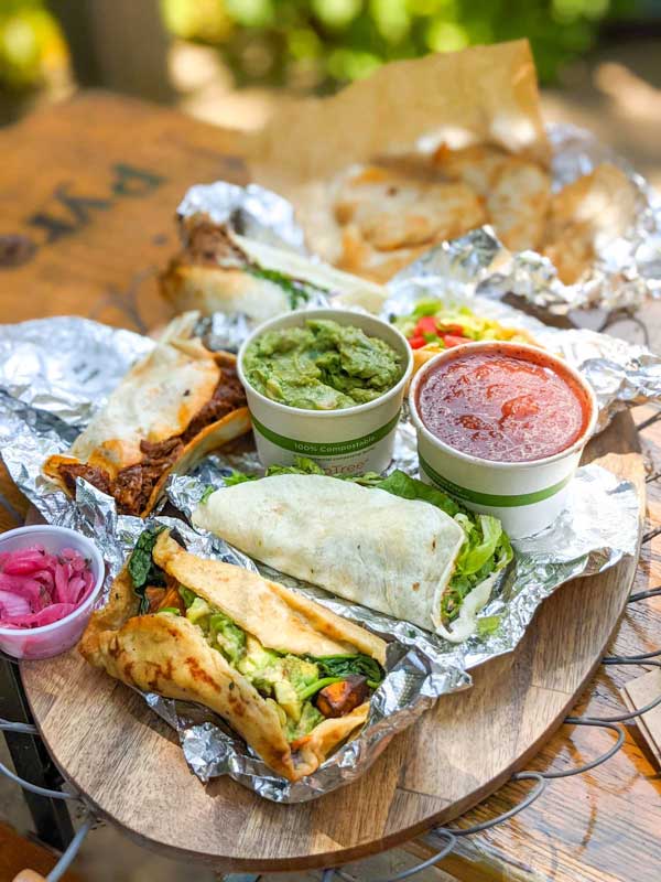 Lunch spread of tacos, chips, salsa and guacamole from Asheville's Taco Billy