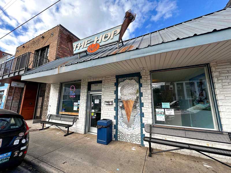 The Hop's West Asheville location with a large mosaic ice cream cone out front