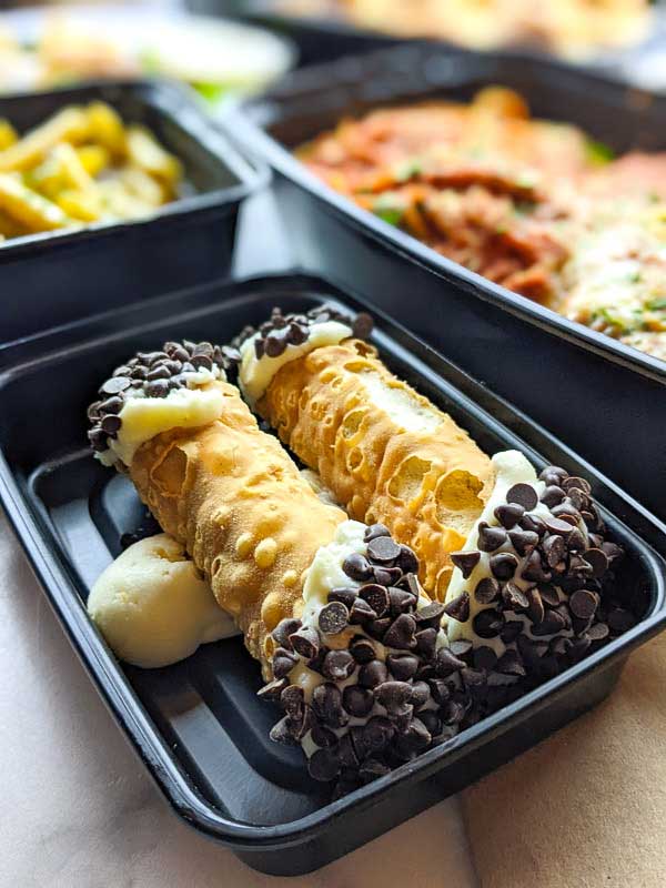 Cannoli in a takeout container from Asheville's Vinnie's Italian Restaurant