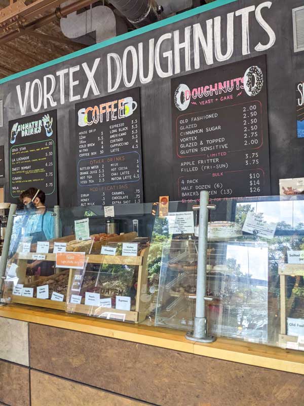 Interior of Vortex, showing coffee and doughnut menus on the wall