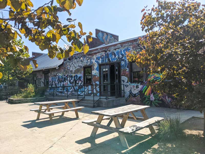 Picnic tables behind Wedge at Foundation in the River Arts District