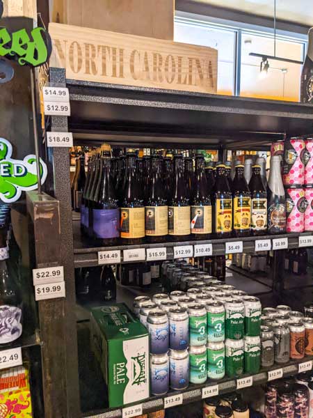 Shelves with local North Carolina beer at Appalachian Vintner beer store.