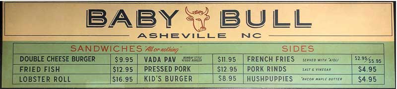Baby Bull's old school-style menu hanging on their wall