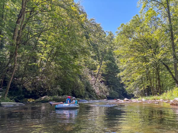 Two people on a tube in Deep Creek in Great Smoky Mountains National Park