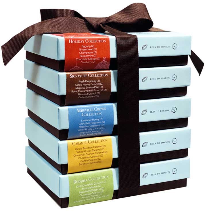 Stack of six boxes of chocolate from French Broad Chocolate tied with a brown ribbon