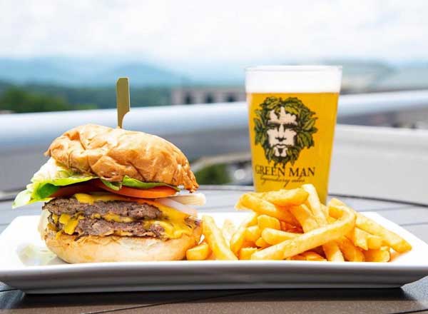 Pilar's Double Burger and fries with a beer at the rooftop restaurant Hemingway's Cuba in Asheville, NC