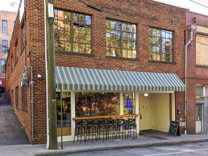 Exterior of La Bodega by Curate in downtown Asheville