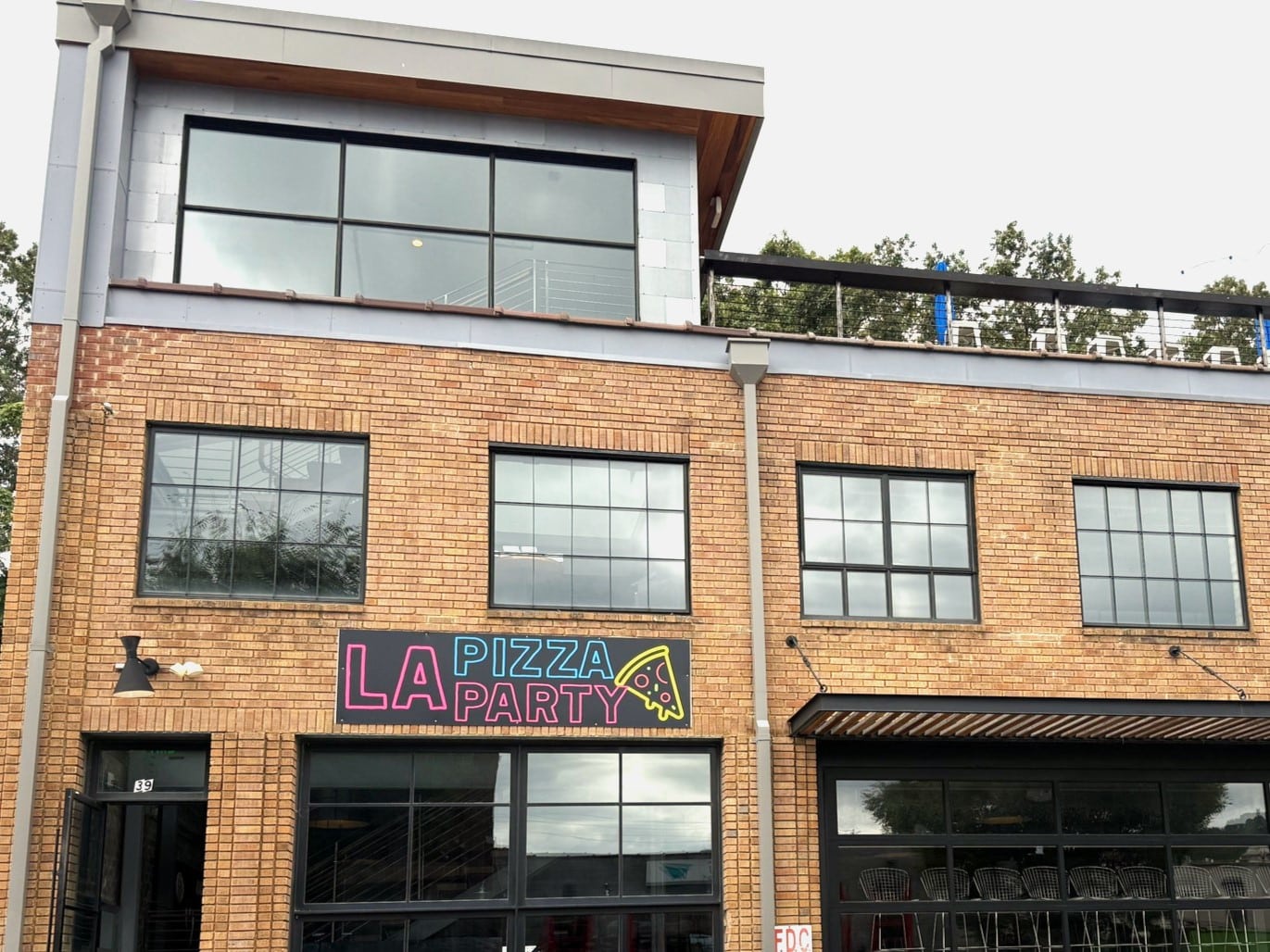 Exterior of La Pizza Party in Asheville's South Slope neighborhood.