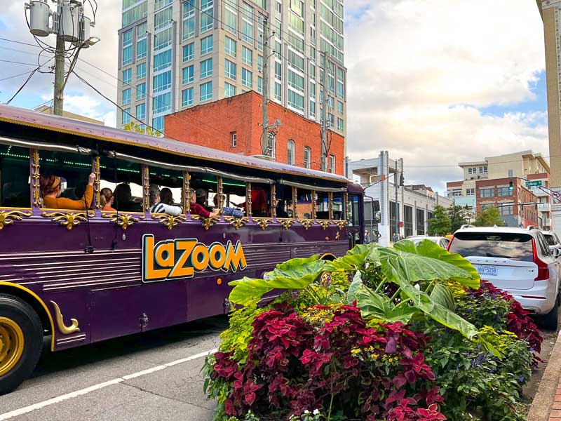 Purple LaZoom comedy tour bus in downtown Asheville