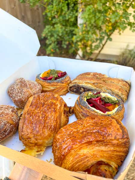 Assorted pastries in a box from Asheville's OWL Bakery