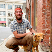 Sprouted Scribbles owner Travis Clement and his dog in downtown Asheville