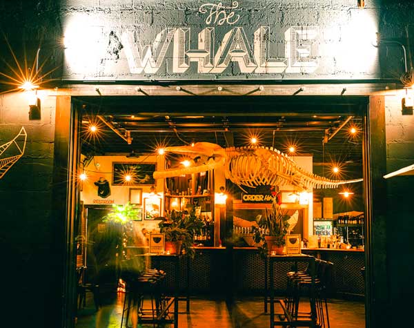 Exterior at night of The Whale Craft Beer Collective in West Asheville.