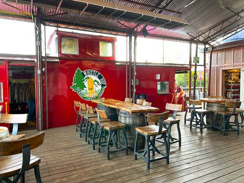 Seating and a train car at Whistle Hop Brewing in Fairview NC